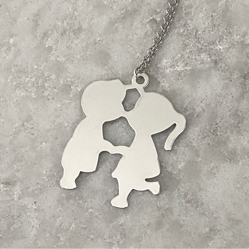 Boy and Girl Kissing Silver Necklace